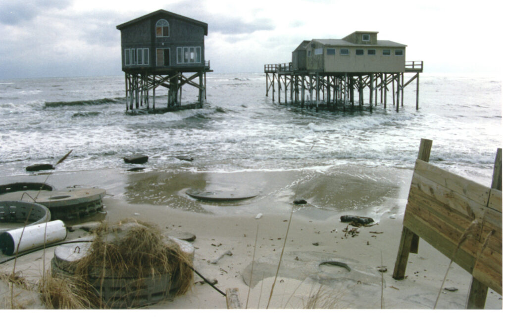 Two houses on Dune Road in the ocean